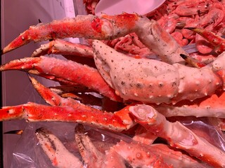 Large lobster crayfish in the store. Large lobster claws on a supermarket counter. Concept: seafood.