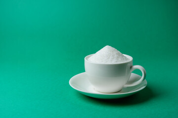 Cup full of sugar, too much, overeating. Unhealthy drink