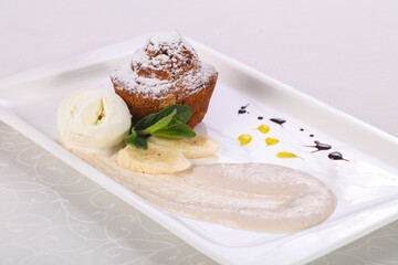 Tasty hot muffin with ice cream