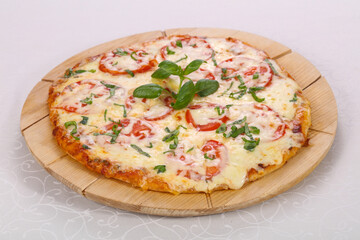 Pizza with tomato and cheese