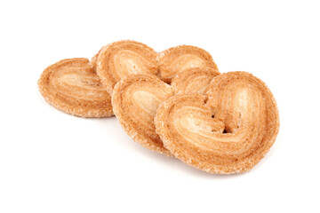 Puff pastry cookies. Fresh puff pastry cookies in the shape of a heart. Classic French pastries. Pig ear, elephant ear cookies, French hearts. Heart shaped puff pastry isolated on white background