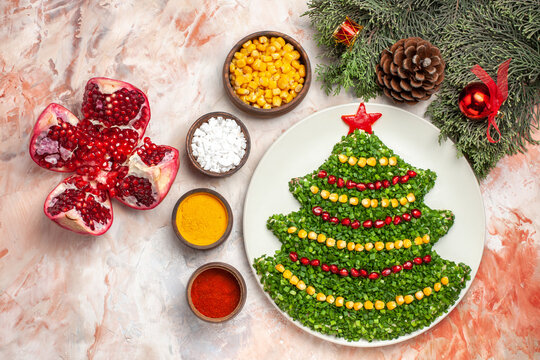 top view green salad in new year tree shape with seasonings on light background salad meal color xmas photos