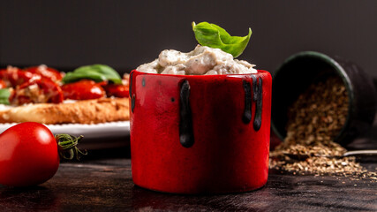 Crostini with toasted baguette, cottage cheese and tomatoes. cream cheese with basil