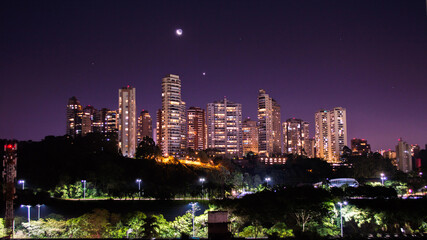 São Paulo skyline lights with moon and stars