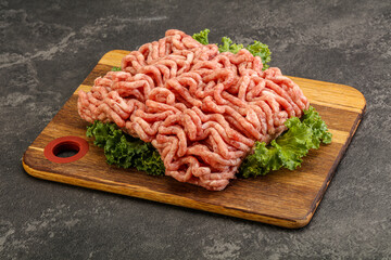 Raw pork minced meat over board