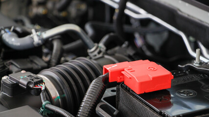 Close up car battery with car engine. Maintenance car repair automotive concept. Transportations concept.