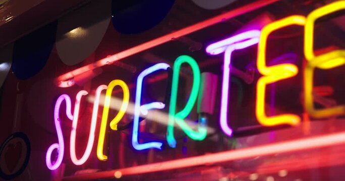 Colorful Neon Light Front Of Night Club, Night exterior video footage of vintage neon sign.
