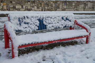 
rest benches covered with snow, snowy day.