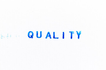 Blue color ink of rubber stamp in word quality on white paper background