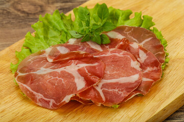 Fototapeta premium Smoked pork neck slices snack
