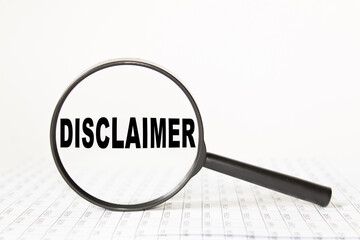 words DISCLAIMER in a magnifying glass on a white background. business concept