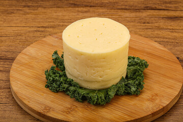 Yellow round dairy soft cheese