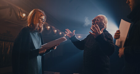 Man and woman playing romantic scene near director