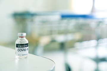 Vaccine covid19 bottle on desk lab in hospital result from research and development of scientist