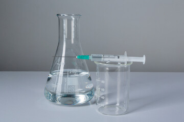 Coronavirus vaccine calendar with syringe on white background