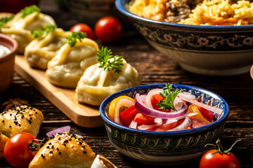 Uzbek prepared boiled Manti or manty dumplings in a traditional bowl on wooden table