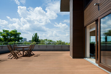 Spacious terrace with wooden floor