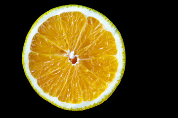 halved orange with black background