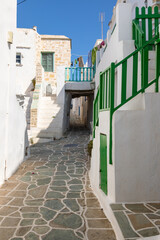 View of the narrow side street in Kastro, Folegandros Island, Greece.