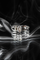 ring on a black background in smoke