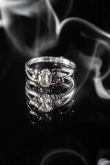 jewelry ring on a black background in smoke