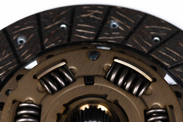 Close-up of a new auto clutch disc. Spare parts for car maintenance and service