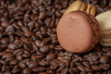 Macarons and coffee beans close up view