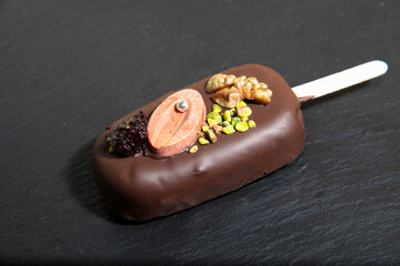 Chocolate cake with nuts and dried fruits. the concept of healthy sweets