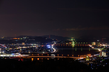 Fototapeta na wymiar Night view of the Fukuyama city area from the top of the mountain.