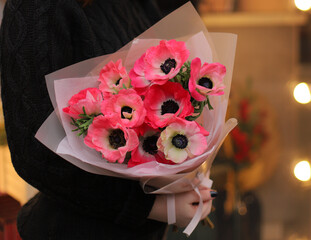 Bouquet of flowers, colored red anemone. Beautiful mono bouquet of big anemones