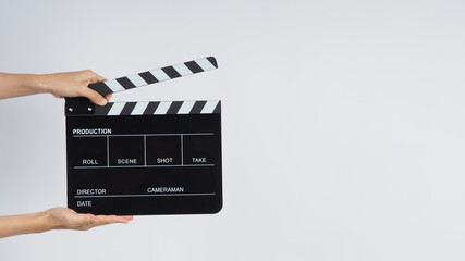 Hands is holding black Clapper board or Clapperboard or movie slate. it use in video production...
