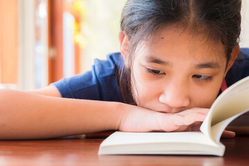 Child Read the Book Closely the Table