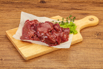 Raw chicken liver over board