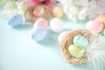 Easter greeting card background with eggs, flowers and butterflies copy space