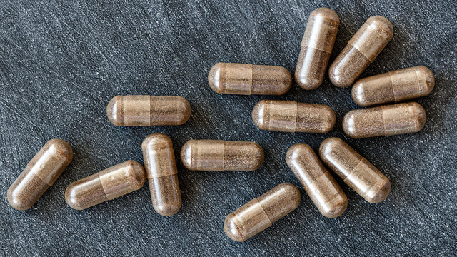 close-up of licorice (DGL) capsules. dietary concept. dietary supplement topview.