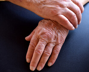 male hands on black surface