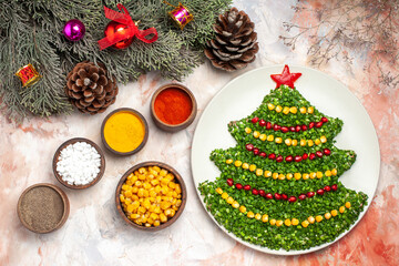 top view tasty green salad in new year tree shape with seasonings on a light background health xmas color holiday meal photo