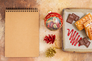 top view yummy waffle cakes with chocolate bars on a brown background biscuit dessert cake xmas sweet