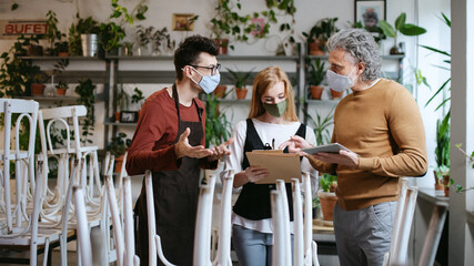 Frustrated owner, manager arguing with waiter in closed cafe, small business lockdown due to...