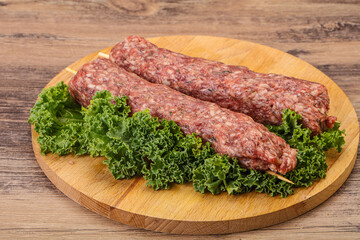 Raw minced beef kebab skewer