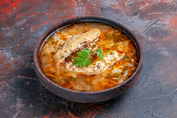 bottom view homemade chicken and rice soup on dark background