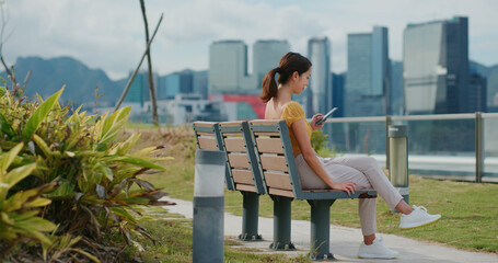 Woman use of mobile phone at outdoor