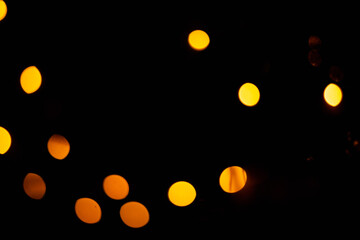 Texture of blurred bokeh colorful lights on black background