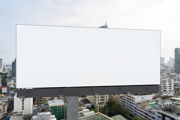 Blank white road billboard with Bangkok cityscape background at day time. Street advertising poster, mock up, 3D rendering. Front view. The concept of marketing communication to promote or sell idea.