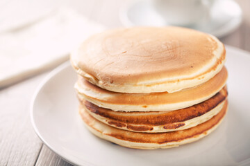 Delicious buttermilk stock pancakes on a plate.