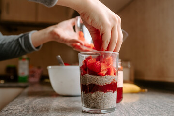 happy girl preparing healthy snack at home
