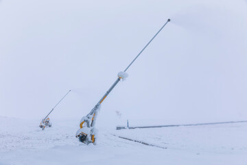 Fototapeta na wymiar Devices for throwing snow on ski slopes