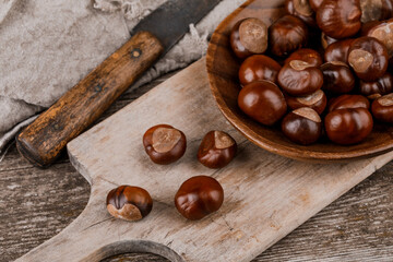 Chestnuts on an old wooden table