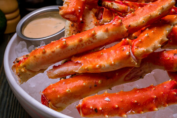 King crab claws on wooden table
