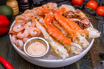 assorted seafood on ice, crab, shrimps, prawns, squid